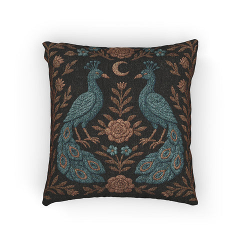 Square woven tapestry pillow featuring two symmetrical embroidered peacocks with a crescent moon and floral detailing on a dark background. The pillow measures 17x18 inches and is crafted from a cotton-polyester blend with plush poly fill. Both sides display the same ornate design. Decorative and gothic in style, suitable for cottagecore, whimsigoth, and folklore-inspired home decor settings.